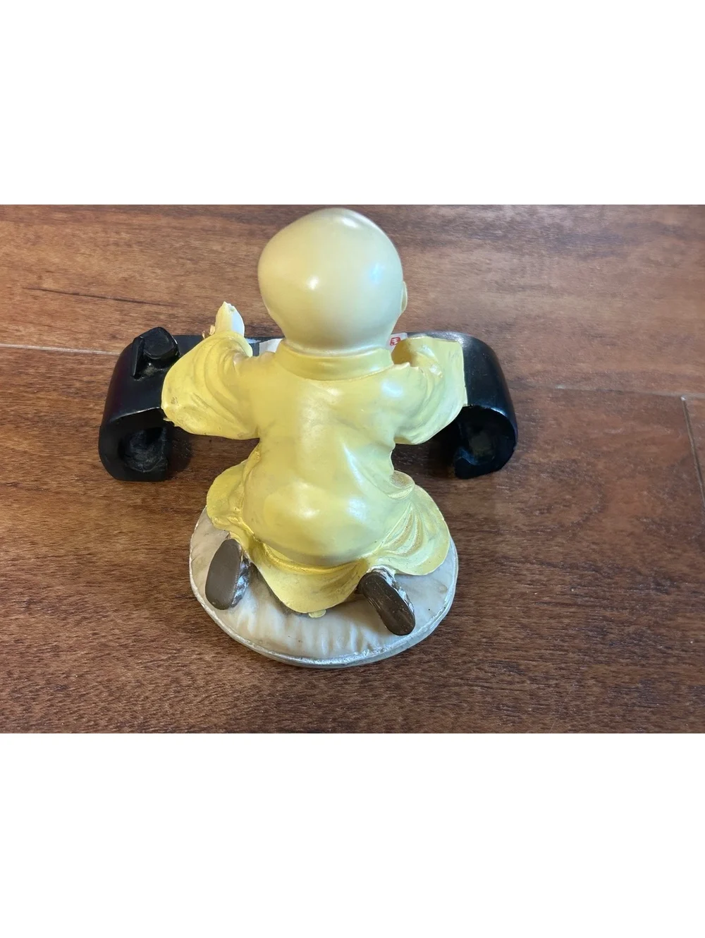 Vintage Yellow Monk Figurine with Scroll and Black Stand